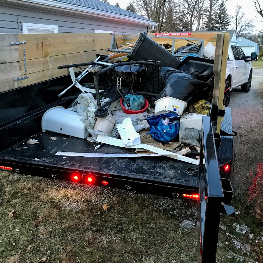 Roll-off dumpster delivered to a residential driveway in Palm Beach